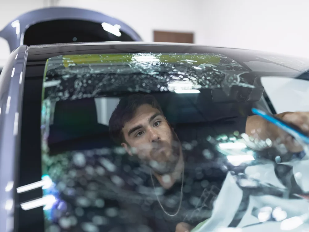 XPEL window film being professionally installed on a vehicle